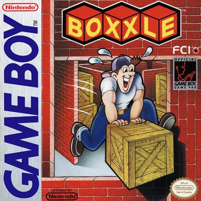 Boxxle cover, on which a horrifically happy man is sweatily shoving a box. I do not like this man.